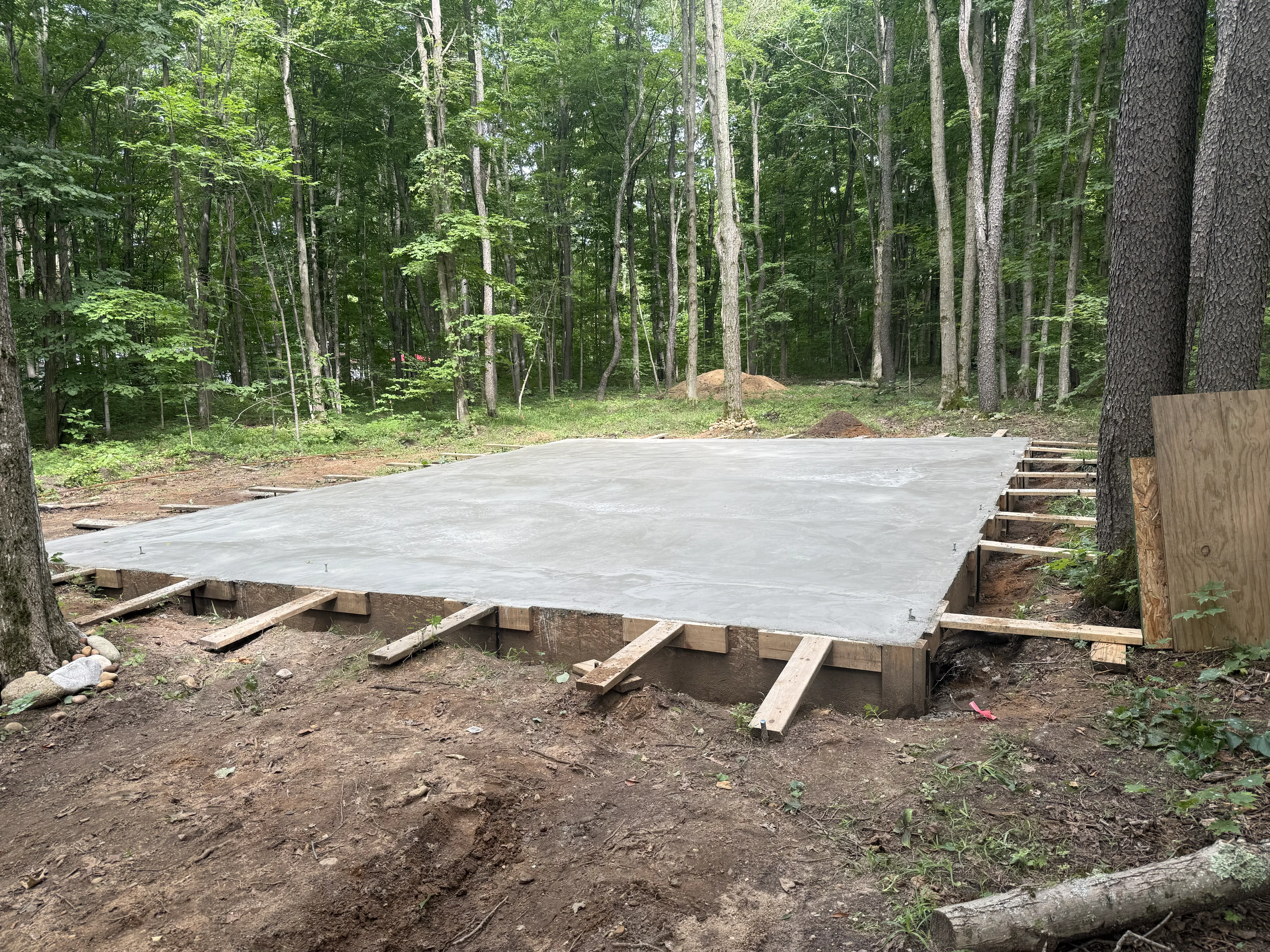Freshly poured and finished concrete slab foundation in northern Michigan