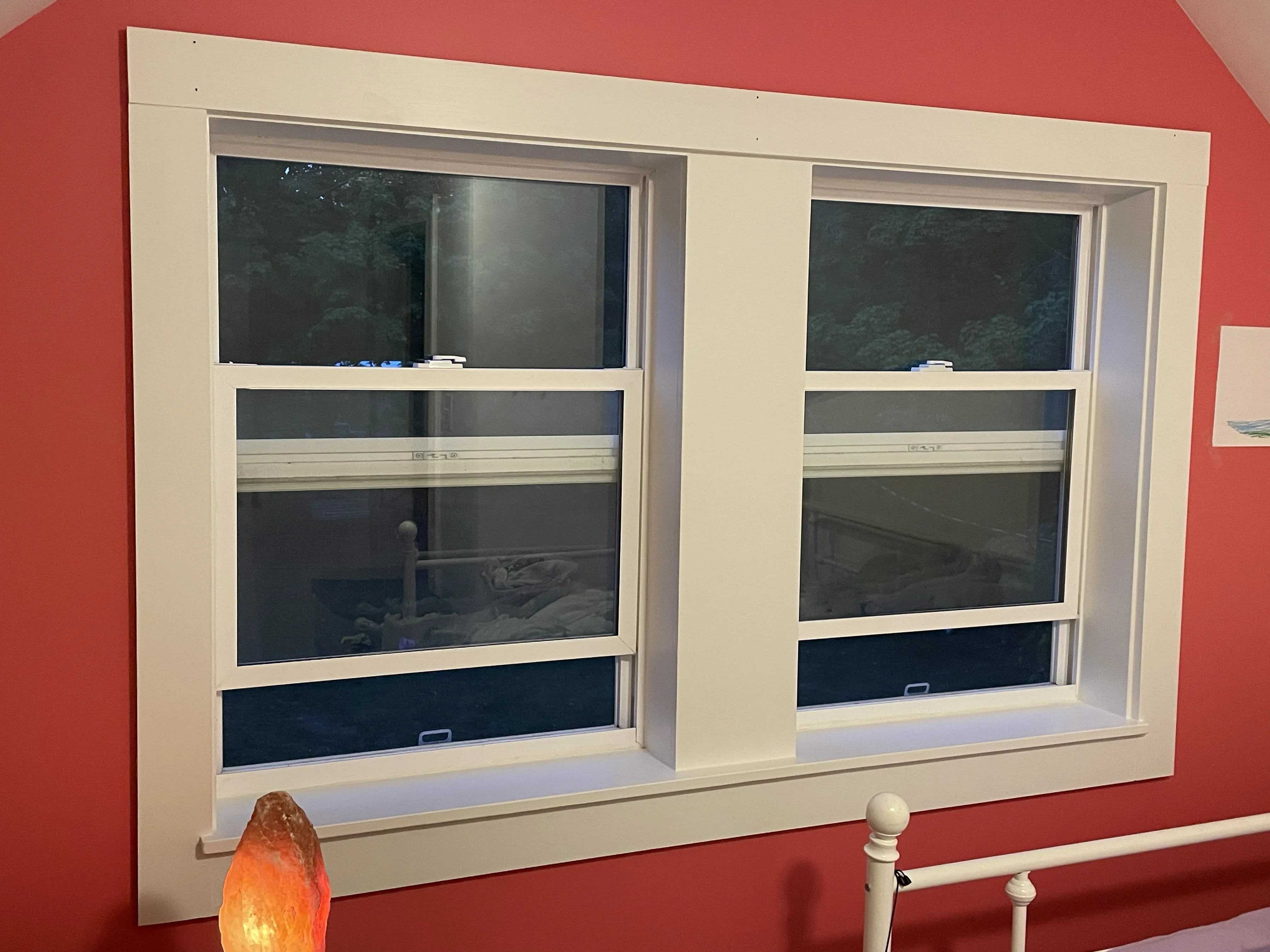 Double-hung windows installed by Gerhard and Sons in a Northwest Michigan bedroom