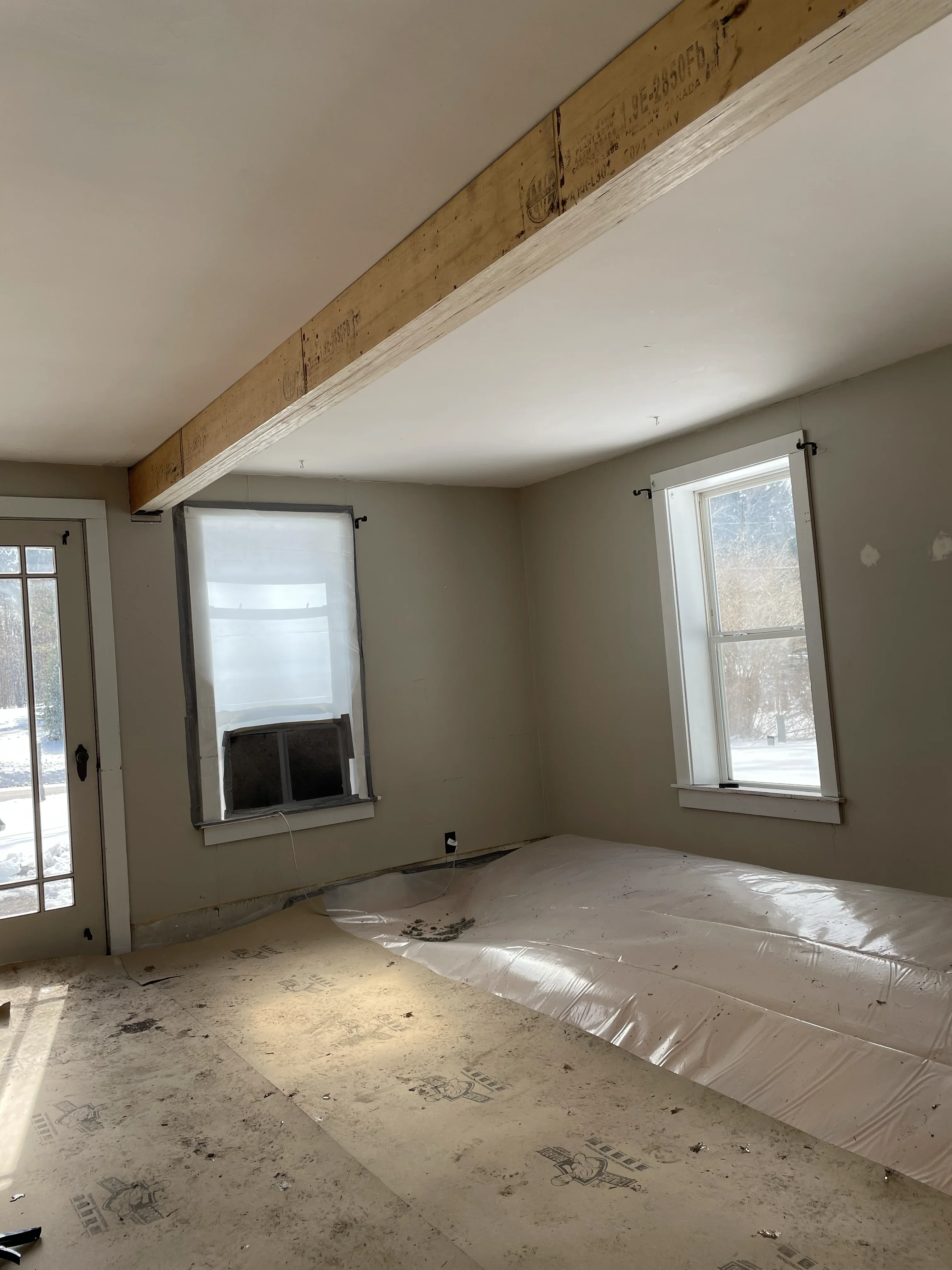 Skylights and transom windows installed on tall interior wall